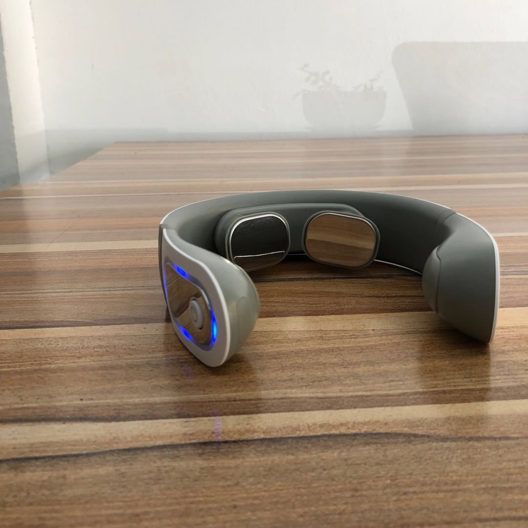 Person using electric neck massager for neck and shoulder muscle relaxation - Neckly™